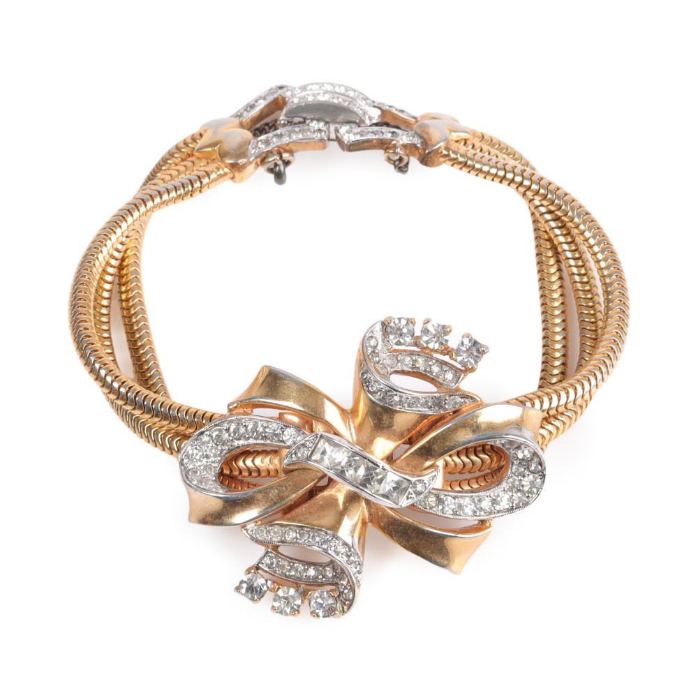 Appraisal: Mazer Retro gold tone triple snake chain diamante layered bow