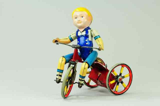 Appraisal: UNIQUE ART KIDDY CYCLIST C 's lithographed tin wind-up toy