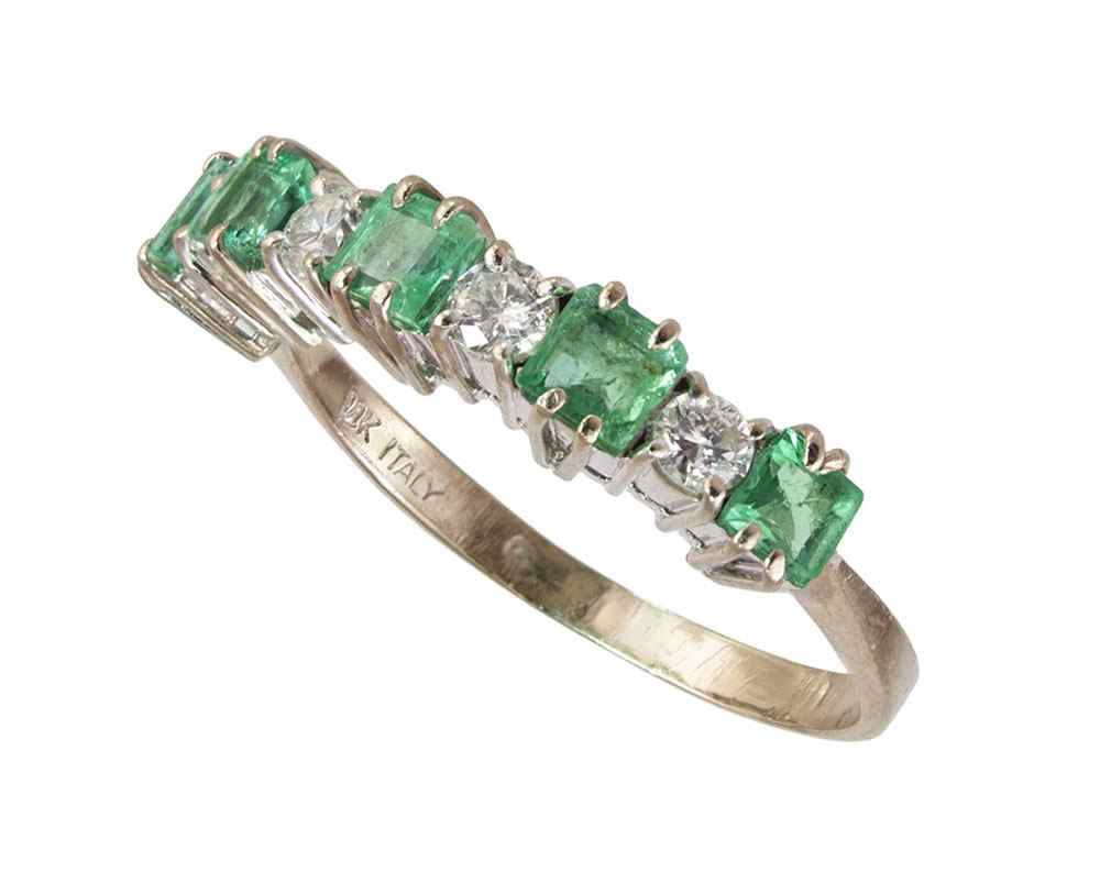 Appraisal: EMERALD AND DIAMOND RING K white gold ring contains round