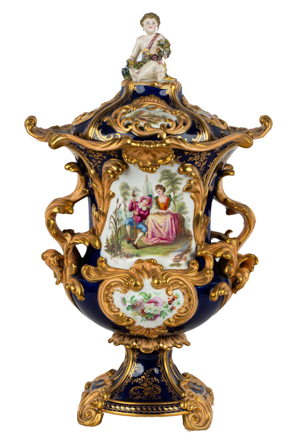 Appraisal: MINTON PORCELAIN GILT COBALT-GROUND COVERED URNunmarked the domed pierced cover