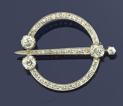 Appraisal: A diamond set Celtic style circular pin in white gold