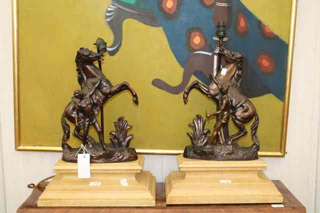 Appraisal: A PAIR OF BRONZED SPELTER MARLEY HORSE TABLE LAMPS on