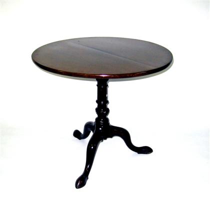 Appraisal: Tilt-top tea tableHaving a circular top over a birdcage and