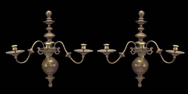 Appraisal: A pair of Dutch Baroque style brass three light wall