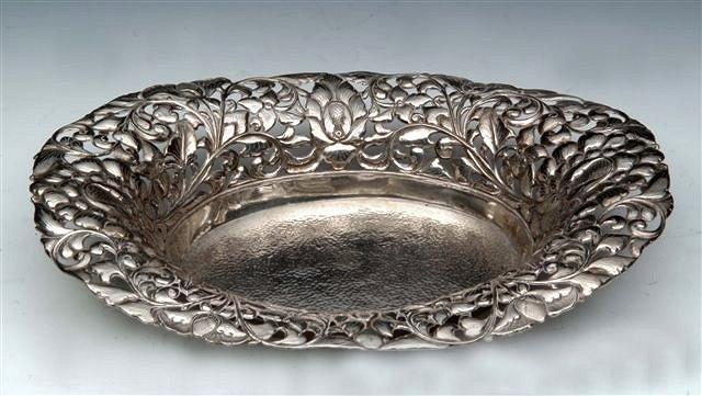 Appraisal: A SILVER OVAL BASKET with pierced foliate and floral border