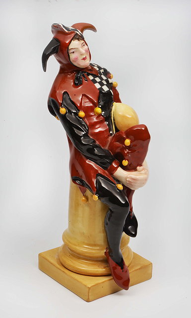 Appraisal: A ROYAL DOULTON FIGURINE of a Court Jester resting on