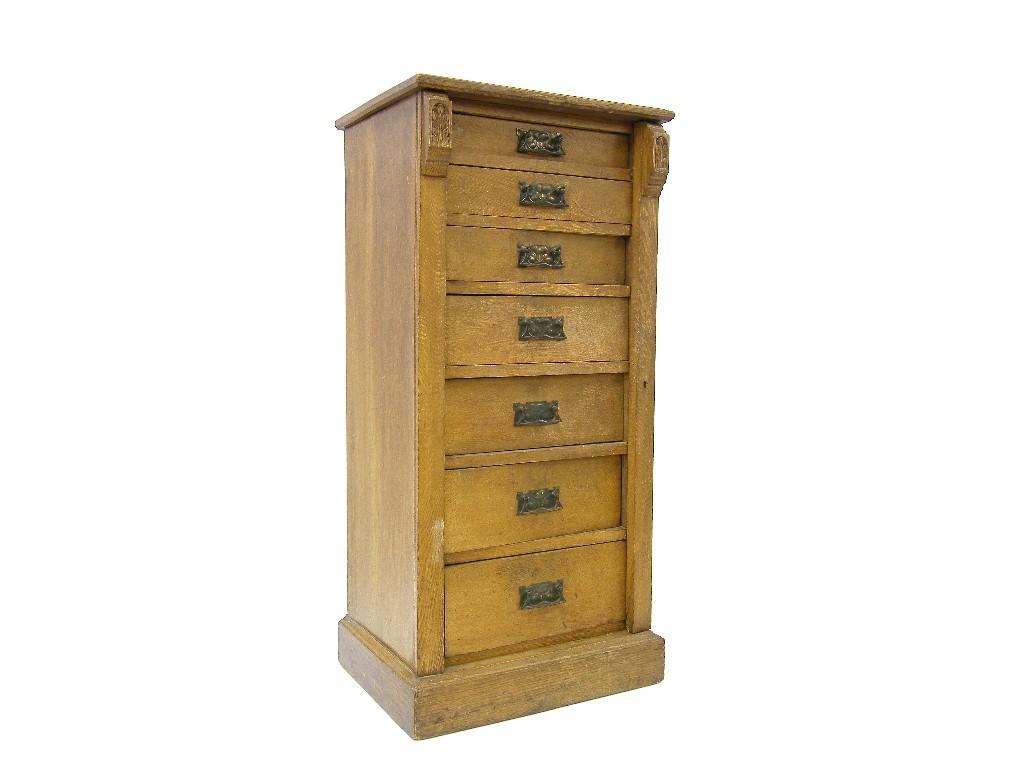 Appraisal: Oak seven drawer Wellington chest with applied Art Nouveau style