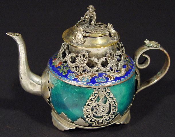 Appraisal: Small Oriental green hardstone teapot and cover with pierced silver