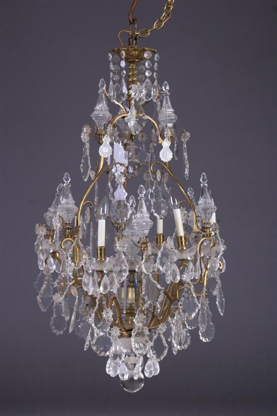 Appraisal: LOUIS XV STYLE GILT BRONZE AND CRYSTAL SIX-LIGHT CHANDELIER th