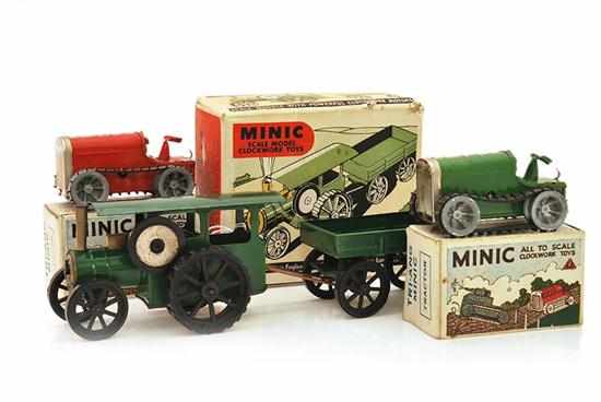 Appraisal: TWO TRIANG MINIC TRACTORS ONE GREEN ONE RED ONE KEY