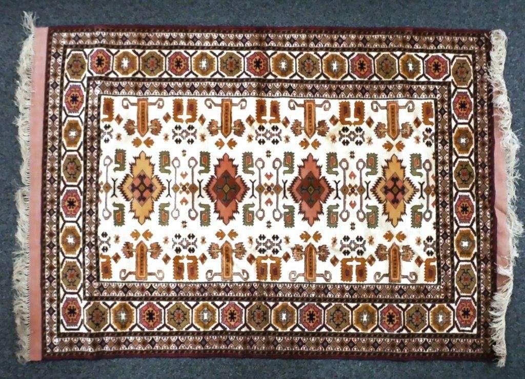 Appraisal: Hand knotted Kazak tribal rug with nice earth tones Field