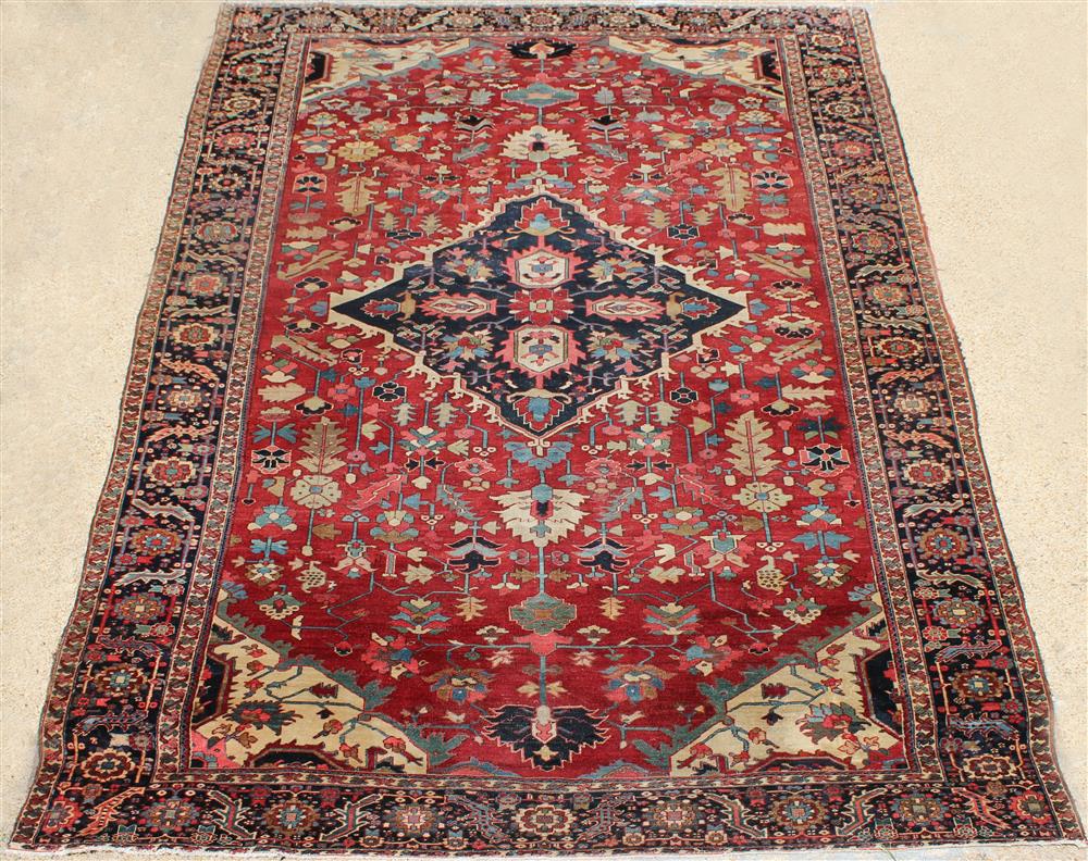 Appraisal: ANTIQUE PERSIAN SERAPI WOOL RUG central medallion surrounded by motifs