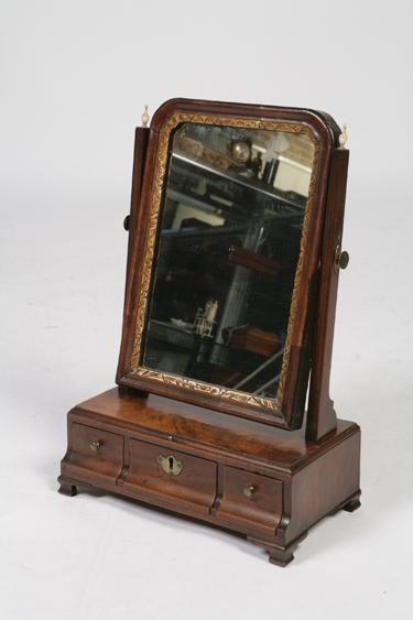 Appraisal: A GEORGE II MAHOGANY DRESSING TABLE MIRROR the rectangular plate