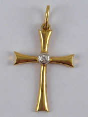 Appraisal: A yellow metal tests carat gold diamond set cross approx