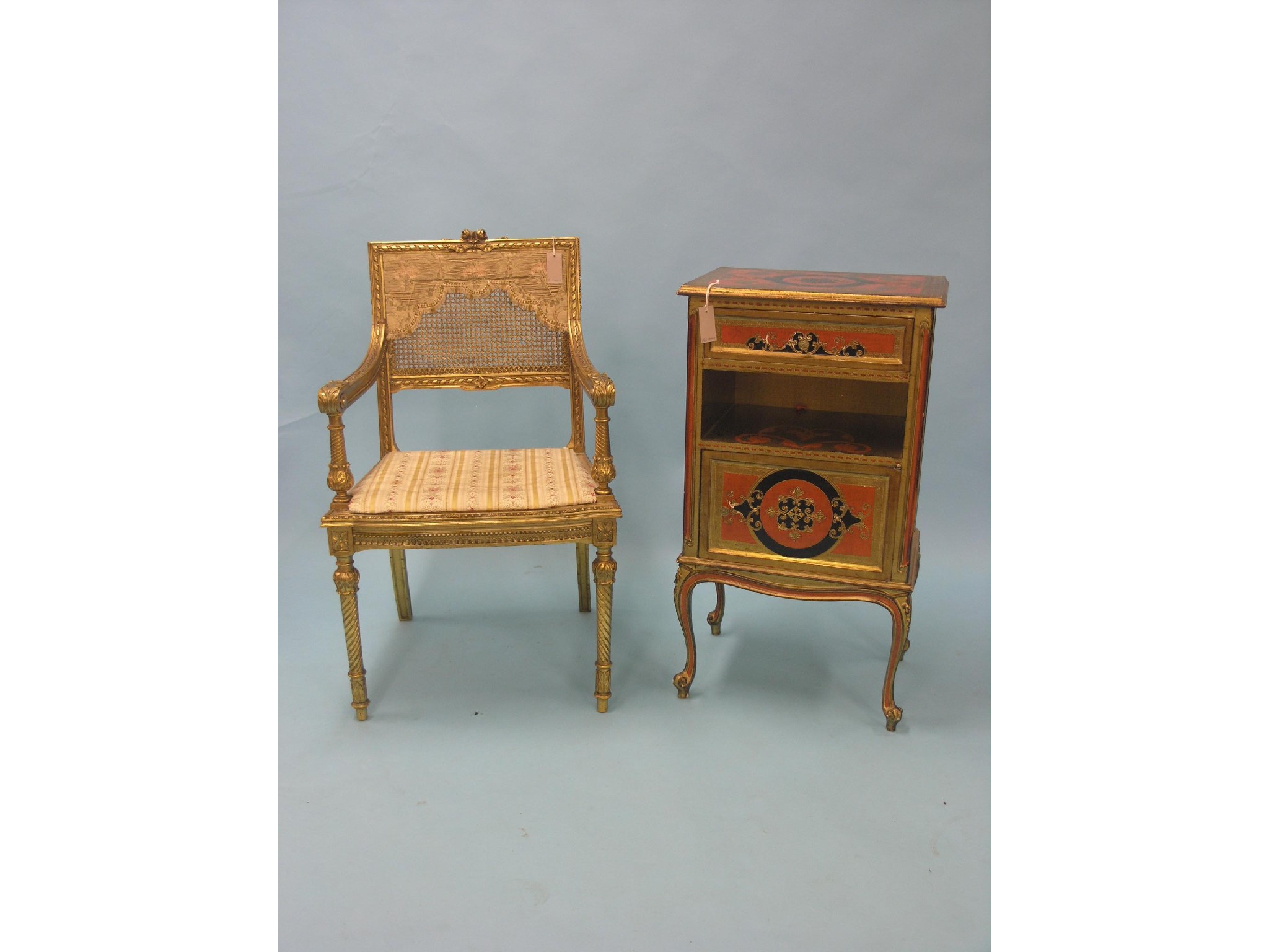 Appraisal: A red black and gilt-finished cupboard with drawer and recess