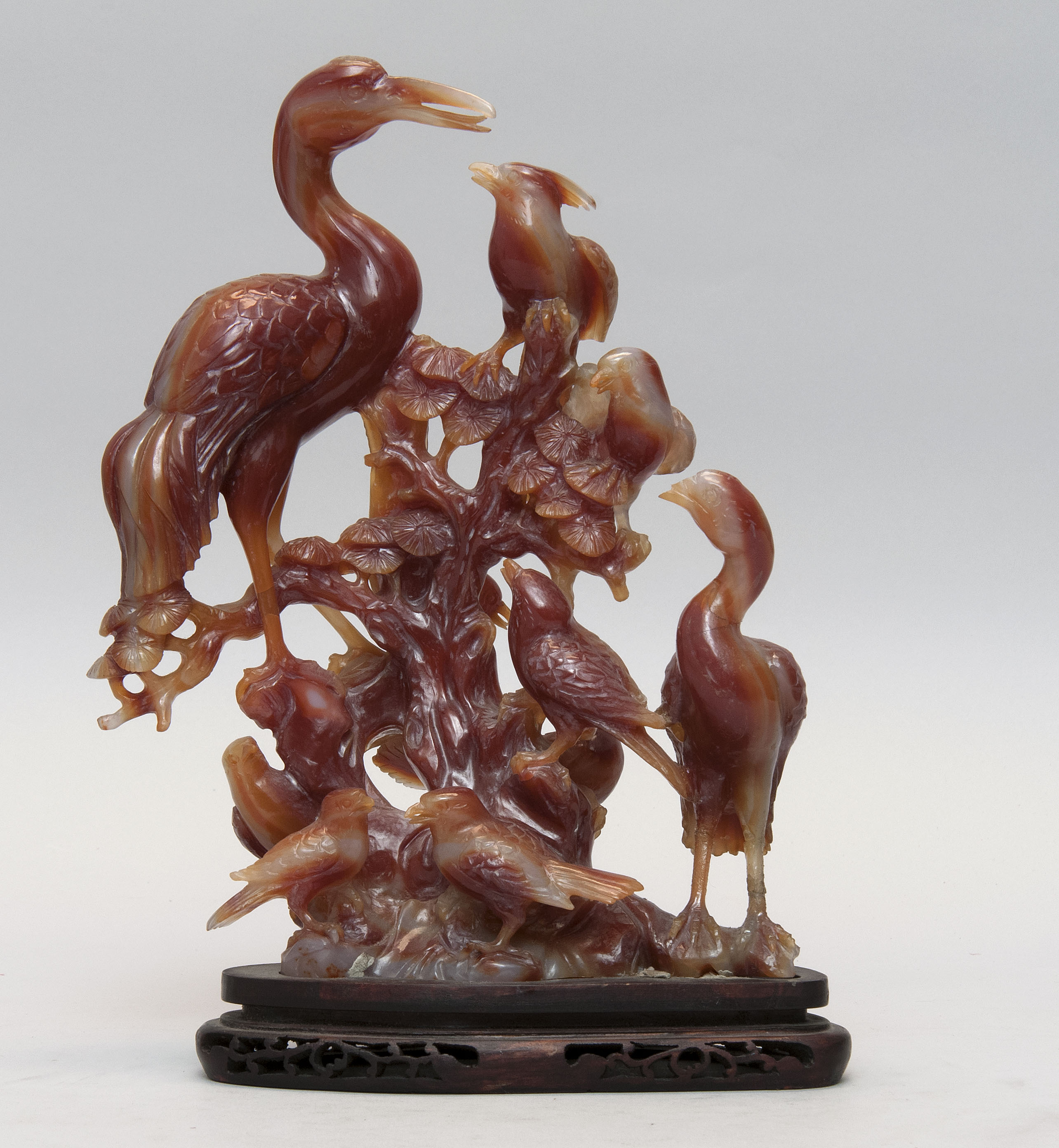 Appraisal: CARNELIAN CARVING Depicting cranes songbirds and pine tree Height cm