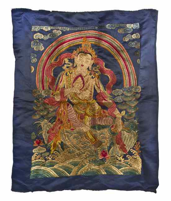 Appraisal: A Silk Embroidered Thangka depicting the deity at center with