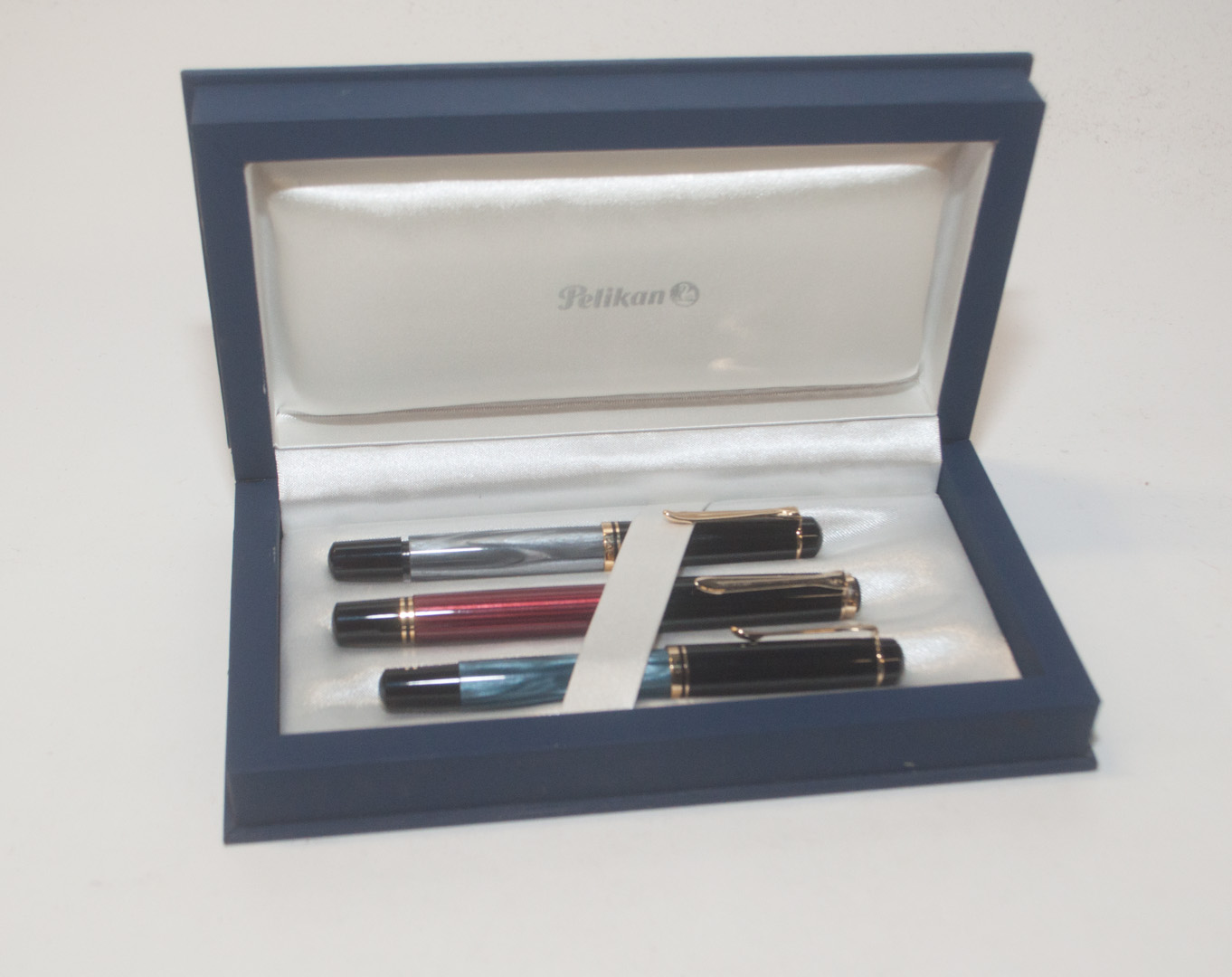 Appraisal: Three Pelikan fountain pens and case Condition Comments added on