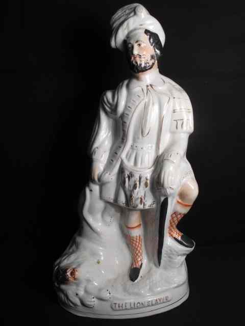 Appraisal: Large th century English Staffordshire figurine titled ''The Lion Slayer''