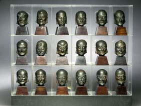 Appraisal: SET EIGHTEEN BRONZE LOHAN HEADS Very unusual and complete set