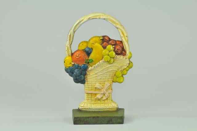 Appraisal: FRUIT IN FRENCH BASKET DOORSTOP BOOK EXAMPLE Judd Company marked