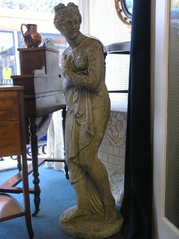 Appraisal: A moulded concrete garden statuette semi nude female ft in