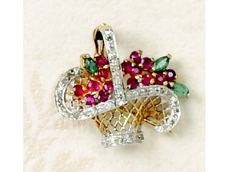 Appraisal: GEMSTONE BROOCH k yellow gold basket design brooch set with