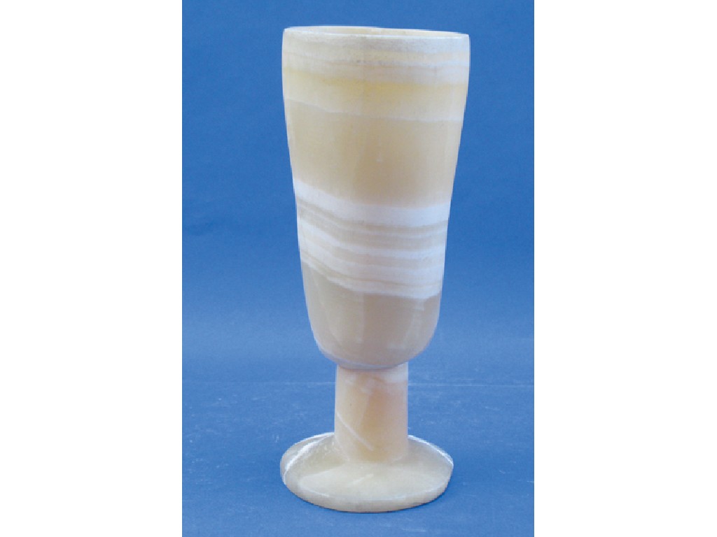 Appraisal: AN EGYPTIAN ALABASTER GOBLET with pale striations with a tapering