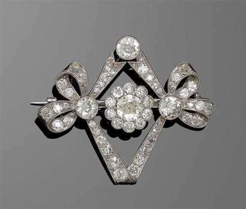 Appraisal: DIAMOND BROOCH ca Platinum Decorative lozenge-shaped brooch of a band