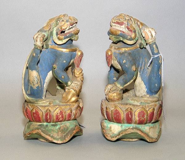 Appraisal: A pair polychrome and gilt painted wood post finials Late