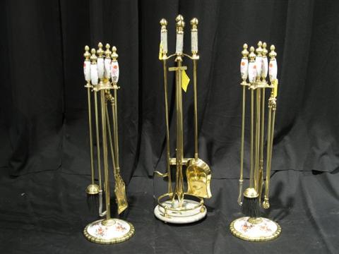 Appraisal: THREE SOLID BRASS FIRE SETS Two have painted ceramic handles