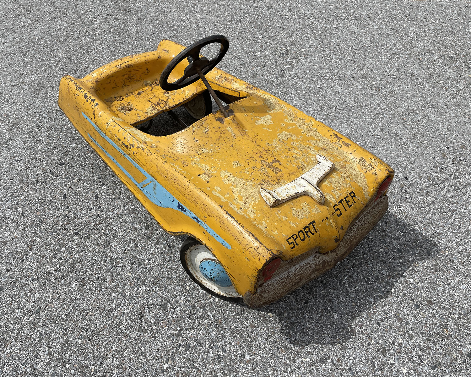 Appraisal: YELLOW SPEEDSTER PEDAL CAR Orangish yellow ''Sportster'' pedal car with