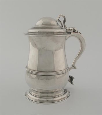 Appraisal: A George II baluster tankard with a spreading foot a