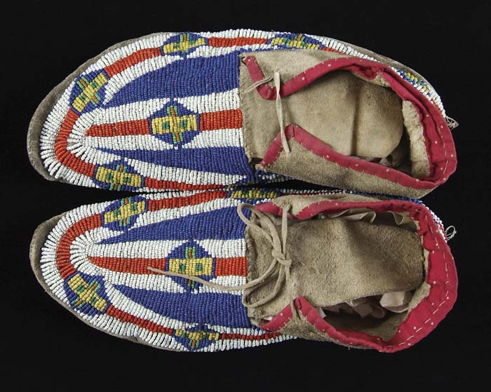 Appraisal: PAIR OF PLAINS INDIANS MOCCASINS Fully beaded geometric design in