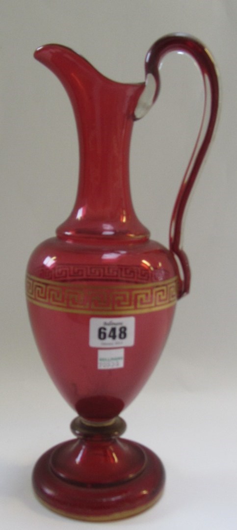 Appraisal: A Victorian cranberry glass ewer with a gilt 'Greek key'