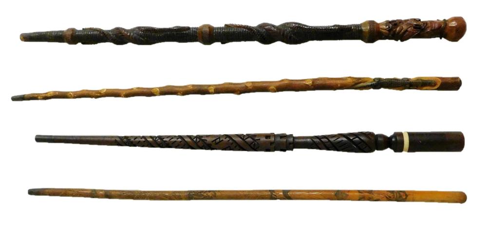 Appraisal: Four carved walking sticks late th early th C one