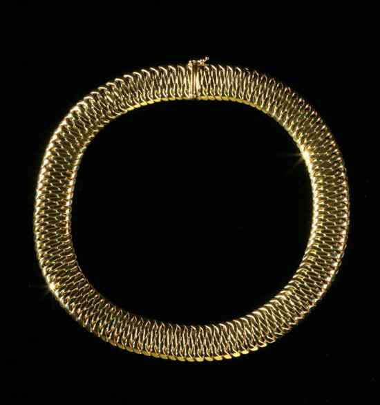 Appraisal: ITALIAN K YELLOW GOLD FLEXIBLE-LINK STRAP CHOKER Bright-polished fitted links