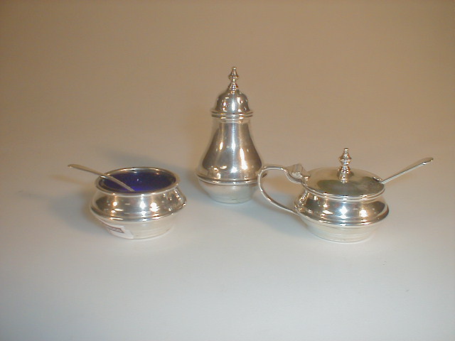 Appraisal: A George V silver three piece cruet set of baluster