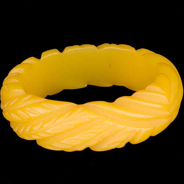 Appraisal: Carved Bakelite Bangle A carved Bakelite bangle all signed pieces