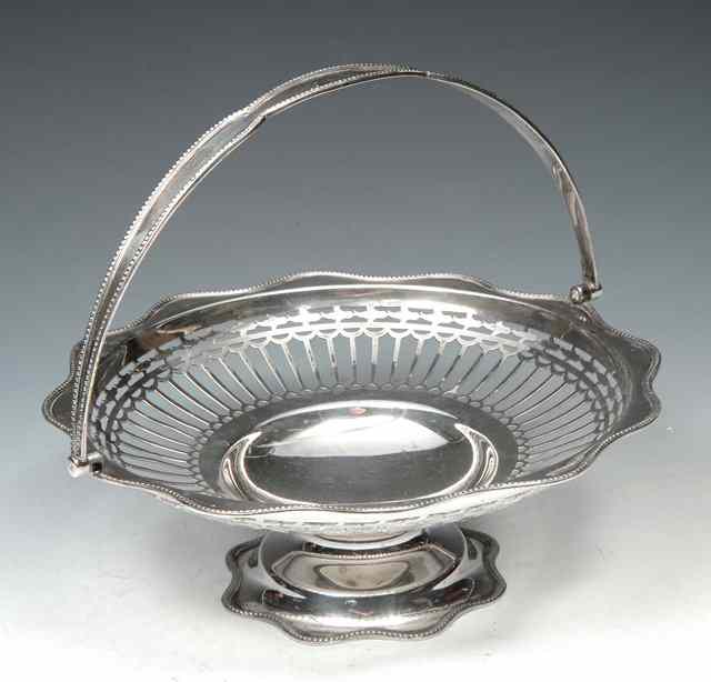 Appraisal: A GEORGE V CIRCULAR PIERCED SILVER BASKET with beaded wavy