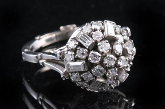 Appraisal: PLATINUM AND DIAMOND DOME RING Round openwork dome set with