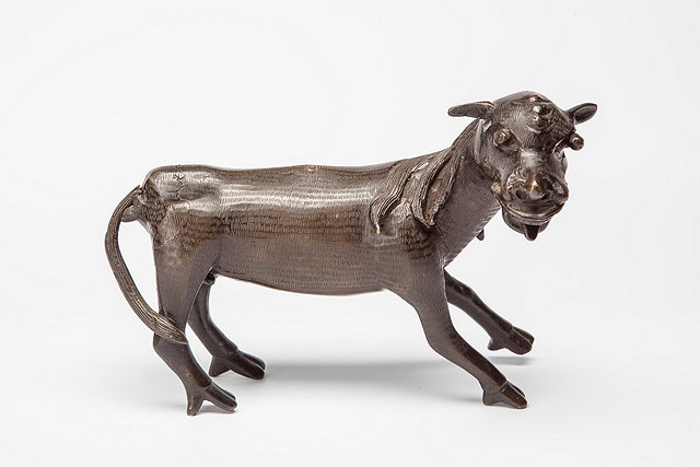 Appraisal: A CHINESE BRONZE KYLIN standing with front paws outstretched th