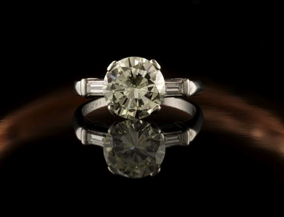 Appraisal: Lady's Platinum and Diamond Engagement-Style Ring composed on a central