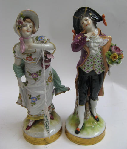 Appraisal: PAIR OF DRESDEN GERMAN PORCELAIN FIGURES hand enameled of a