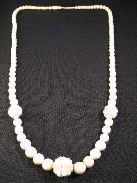 Appraisal: Antique ivory beaded necklace with three rose carved beads No