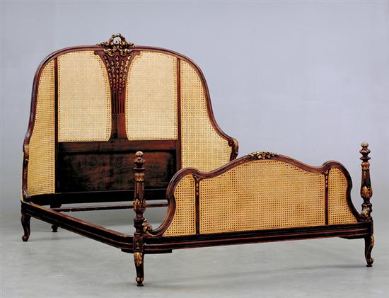 Appraisal: Louis XV style carved fruitwood and caned bed bead-and-channel arched