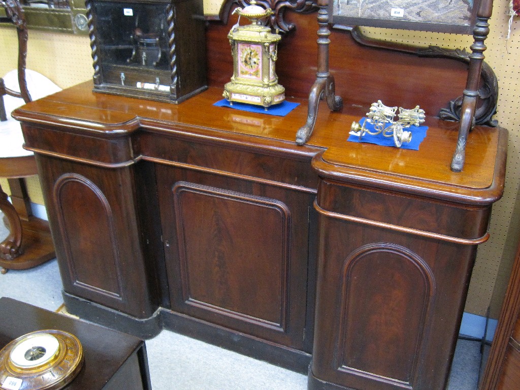 Appraisal: Victorian mahogany sideboard with solid back over three drawers and