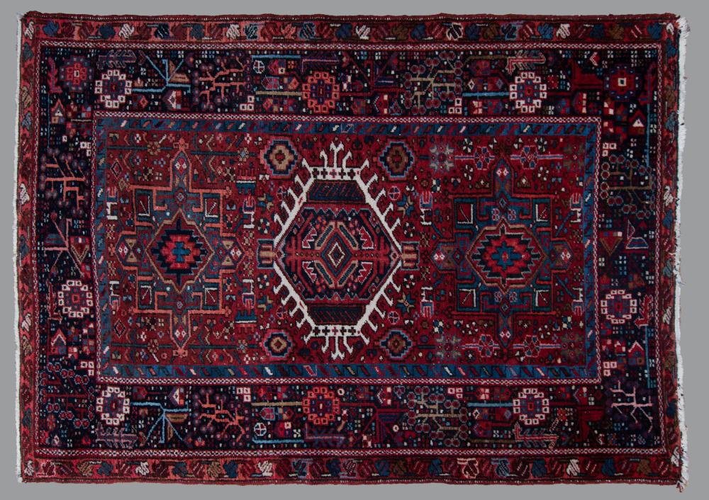 Appraisal: PERSIAN KERAJEH HAND KNOTTED WOOL RUG a tribal design with