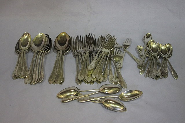 Appraisal: A SUITE OF IRISH SILVER CUTLERY with chased geometric decoration