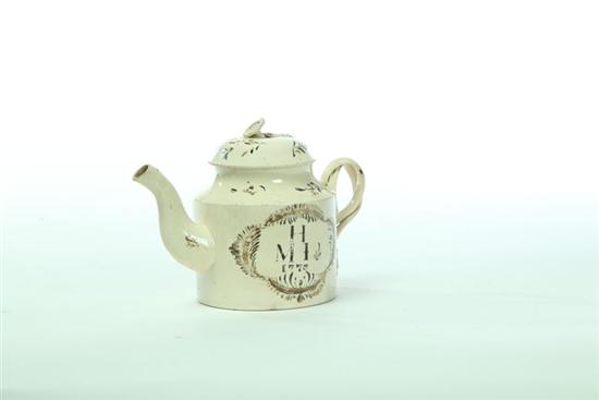 Appraisal: CREAMWARE INDIVIDUAL TEAPOT England nd half- th century Hand painted